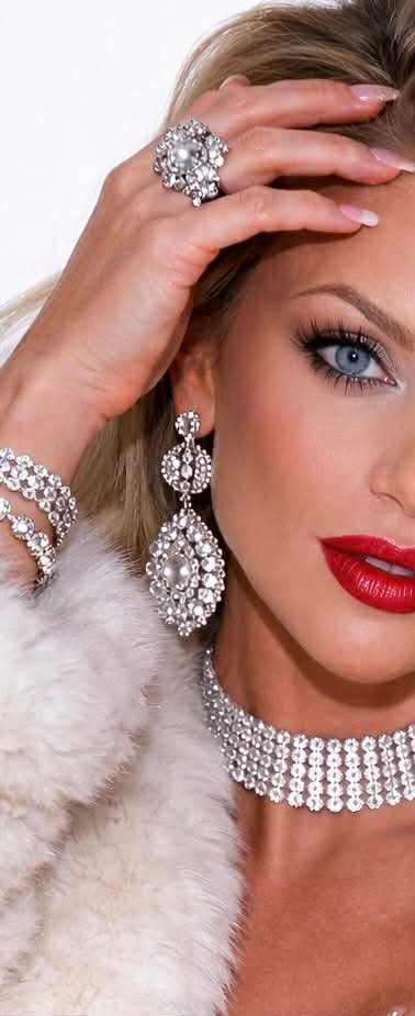 Danielle with a jeweled ring and red lip.